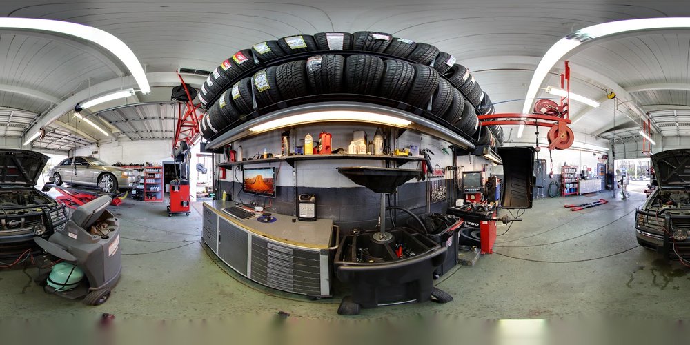 Tire rack and work stations inside Thompson Lane Auto